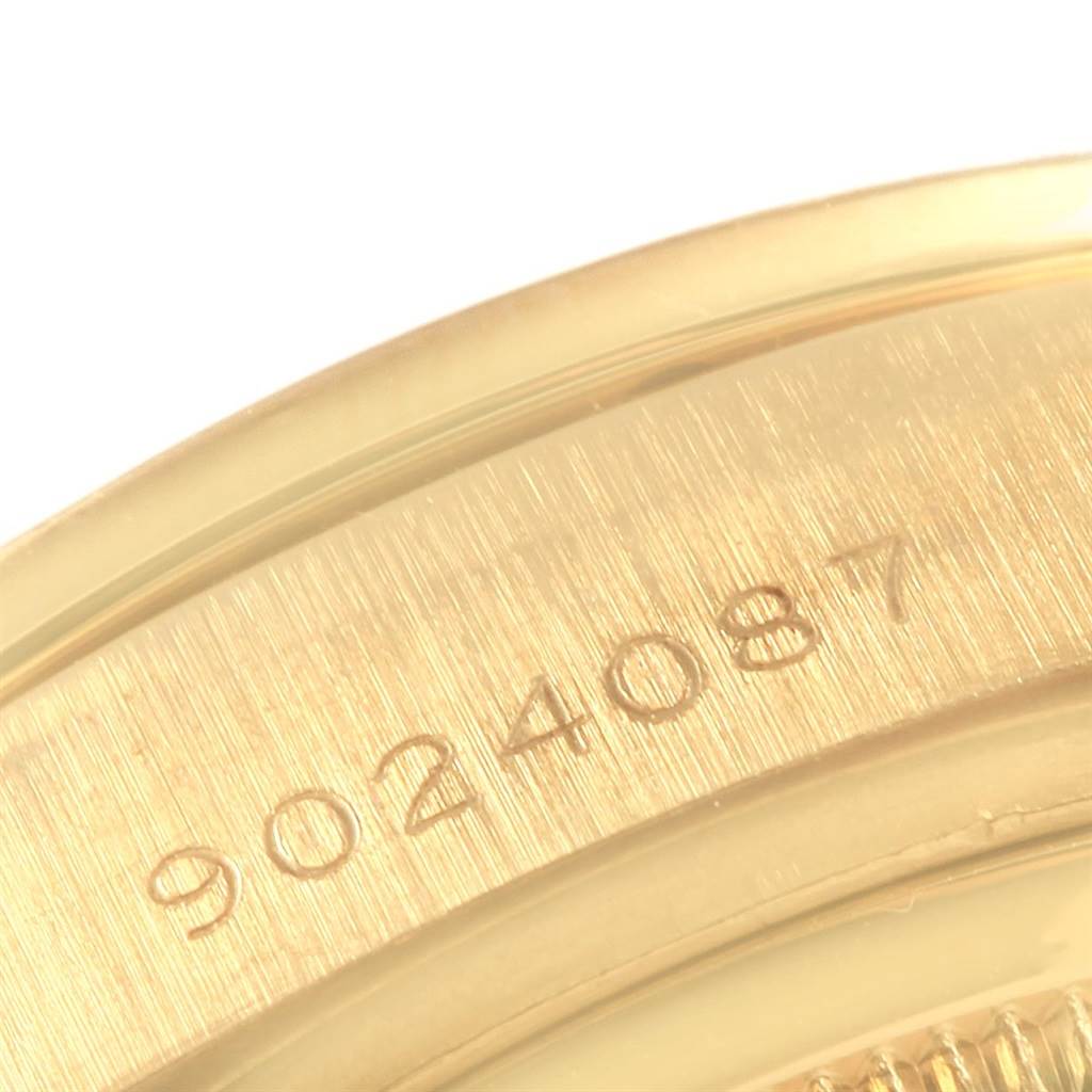 This image shows a close-up angle of the serial number engraved on the case back of a Rolex President 18138 Men
s Yellow Gold Champagne Dial 18138 Men
s Yellow Gold Champagne Dial model watch.