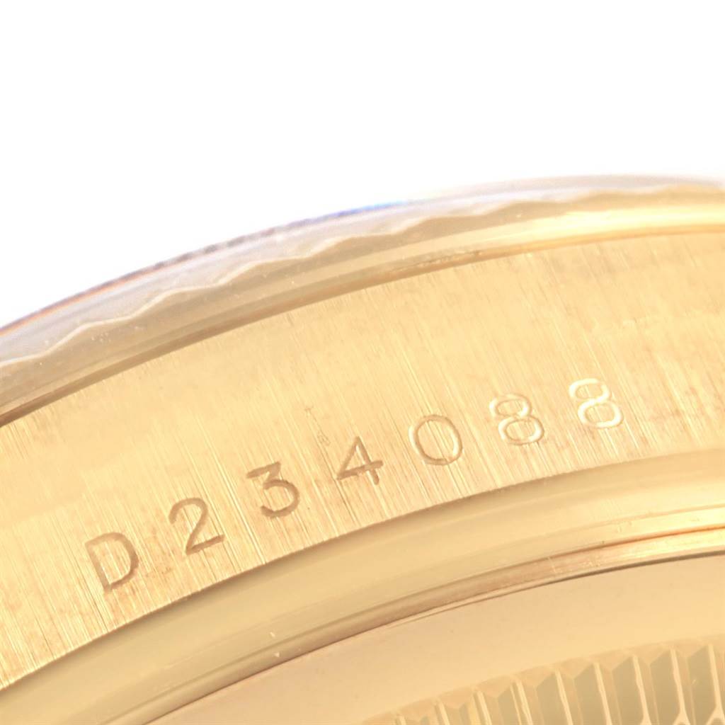 The close-up image shows the engraved serial number on the side of a gold Rolex President 118238 Men's Yellow Gold White Dial 118238 Men's Yellow Gold White Dial watch case.