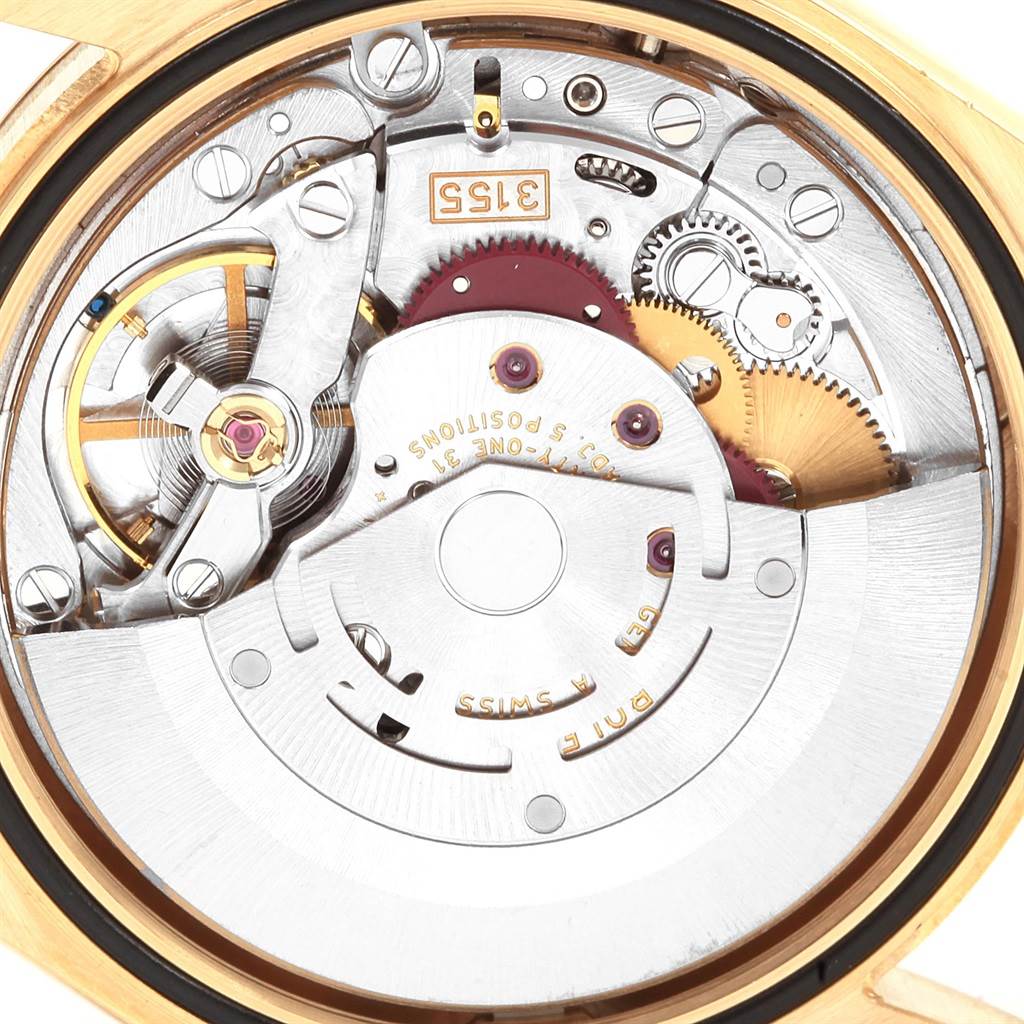 This is a close-up of the movement mechanism inside a Rolex President 118238 Men's Yellow Gold White Dial 118238 Men's Yellow Gold White Dial model watch, showcasing intricate gears and components.