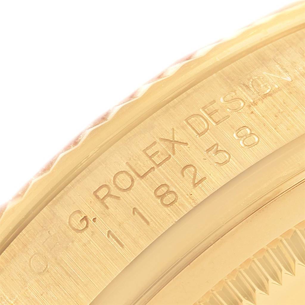This image shows a close-up of the side engraving on a Rolex President 118238 Men's Yellow Gold White Dial 118238 Men's Yellow Gold White Dial model watch.