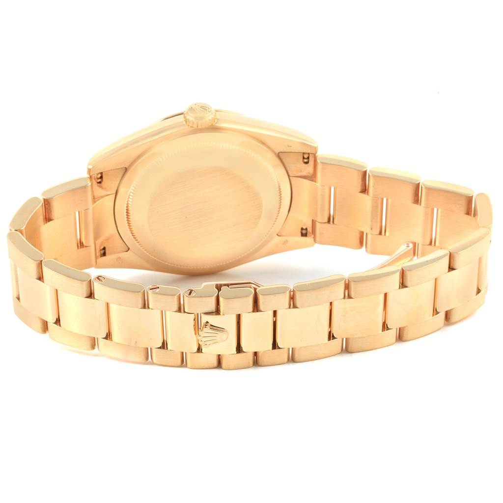 This image shows the Rolex President 118338 Men
s Yellow Gold Champagne Dial 118338 Men
s Yellow Gold Champagne Dial model watch from the rear, highlighting the case back and bracelet.