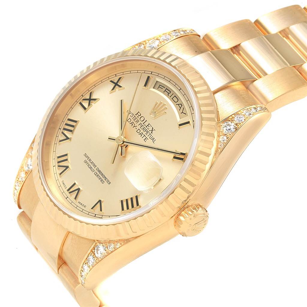 This image shows a close-up, tilted view of the Rolex President 118338 Men
s Yellow Gold Champagne Dial 118338 Men
s Yellow Gold Champagne Dial model watch, highlighting the dial, bezel, crown, and part of the band.