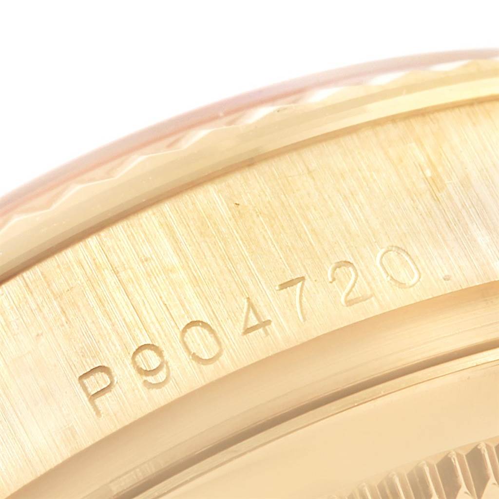 This image shows a close-up of the serial number on the case of a Rolex President 118338 Men
s Yellow Gold Champagne Dial 118338 Men
s Yellow Gold Champagne Dial watch.