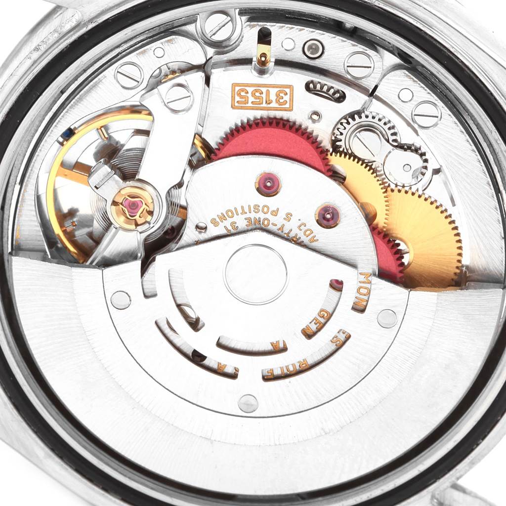 This is a close-up view of the intricate movement inside a Rolex President 118206 Men's Platinum Blue Dial 118206 Men's Platinum Blue Dial watch, highlighting gears and mechanical components.