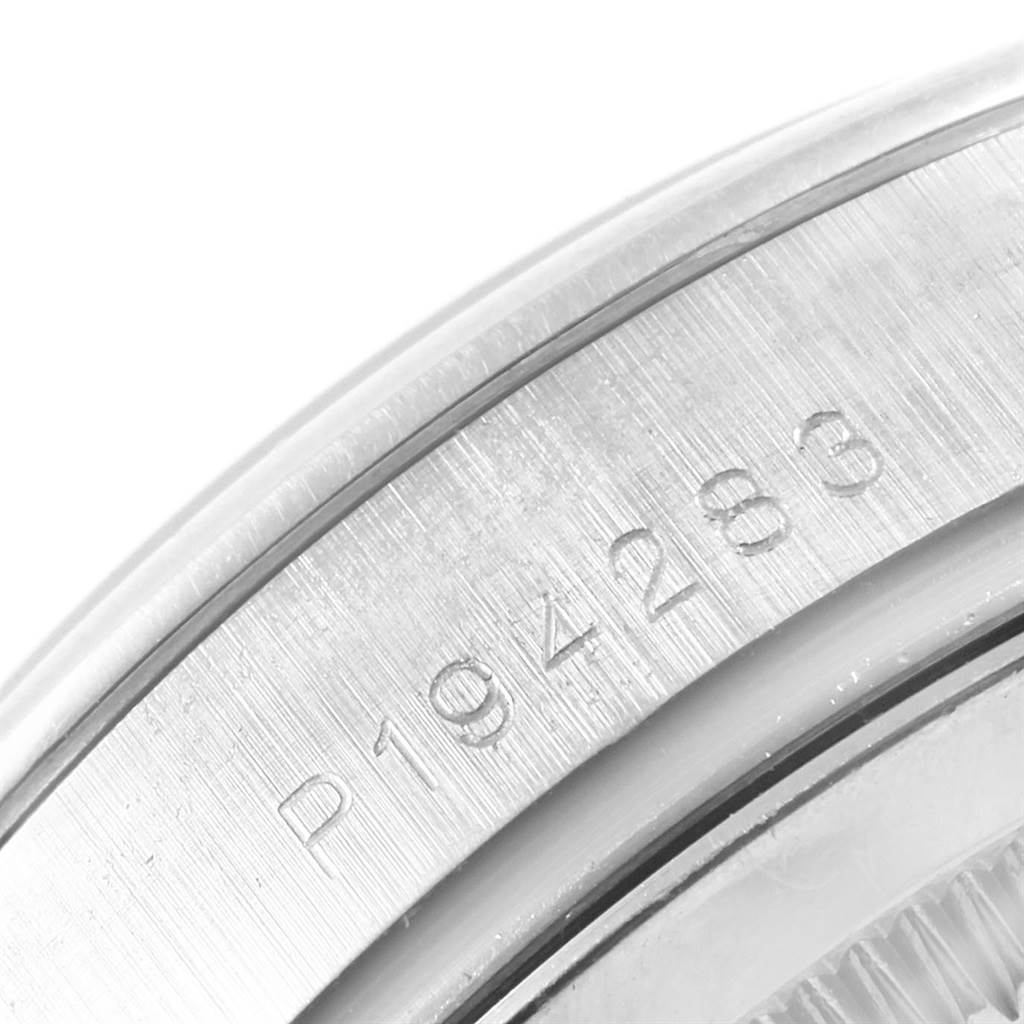 This close-up shows the serial number engraving on the case of a Rolex President 118206 Men's Platinum Blue Dial 118206 Men's Platinum Blue Dial model watch.