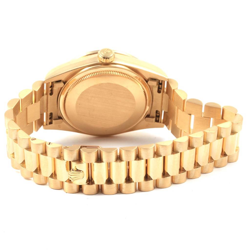 This image shows the case back and bracelet of a Rolex President 18048 Men
s Yellow Gold Champagne Dial 18048 Men
s Yellow Gold Champagne Dial model watch from a rear angle.