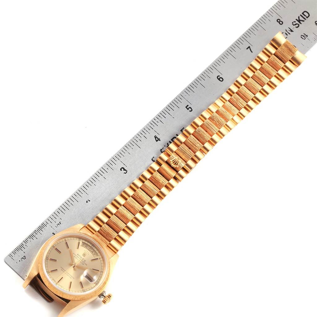 The image shows a gold Rolex President 18078 Men's Yellow Gold Champagne Dial 18078 Men's Yellow Gold Champagne Dial watch laid flat next to a measuring ruler, displaying the dial and bracelet.
