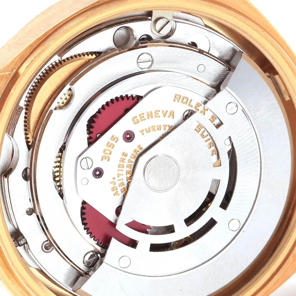 The image shows the inner mechanical movements of a Rolex President 18078 Men's Yellow Gold Champagne Dial 18078 Men's Yellow Gold Champagne Dial model watch, focusing on its gold and silver components.