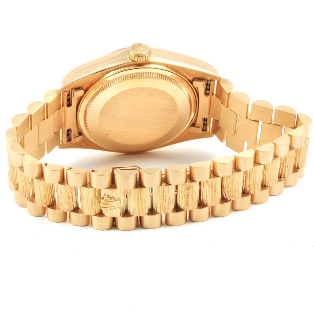 This image shows the back angle of a Rolex President 18078 Men's Yellow Gold Champagne Dial 18078 Men's Yellow Gold Champagne Dial model watch, highlighting its case back and bracelet.