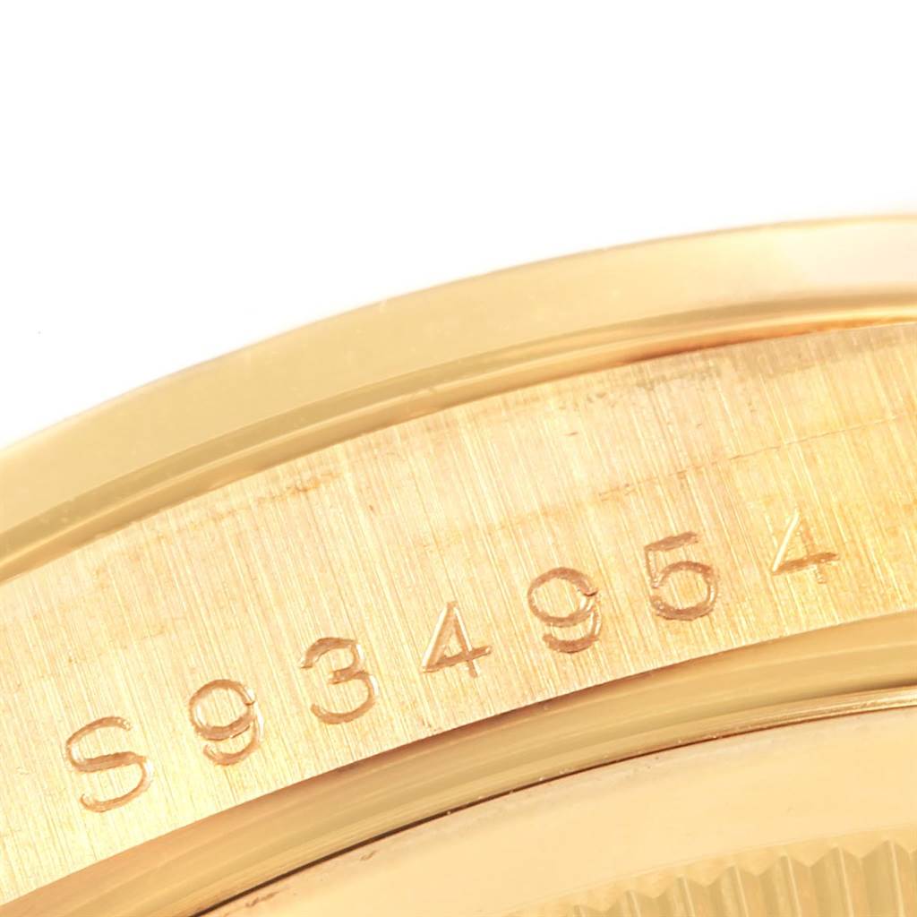 This image shows a close-up view of the serial number engraved on the gold casing of a Rolex President 18388 Men
s Yellow Gold Champagne Dial 18388 Men
s Yellow Gold Champagne Dial model watch.