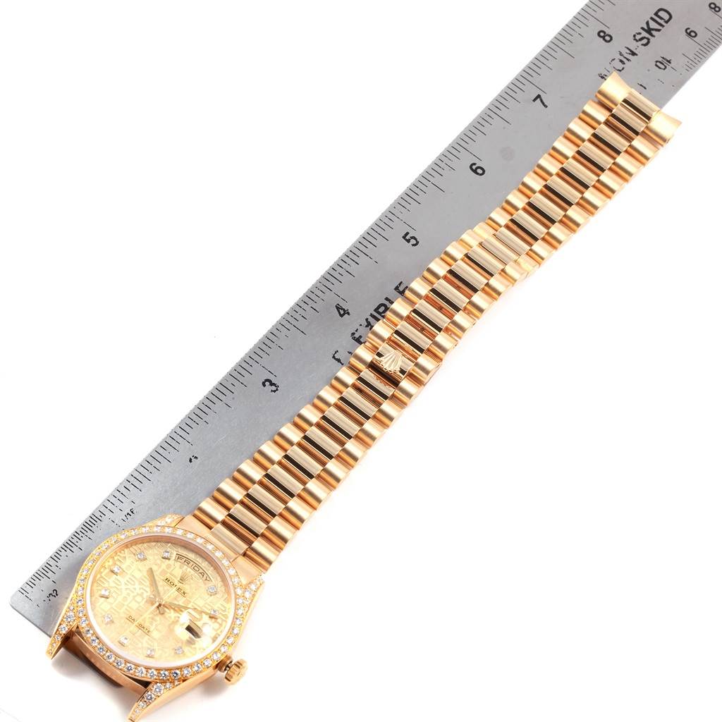 The image shows a top-down view of a Rolex President 18388 Men
s Yellow Gold Champagne Dial 18388 Men
s Yellow Gold Champagne Dial model watch, highlighting the face, bezel, and band alongside a ruler for scale.