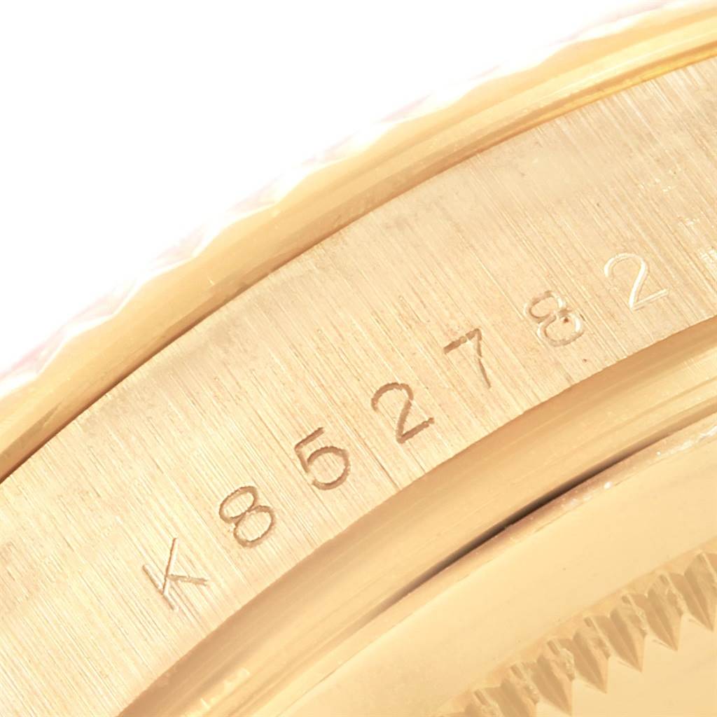 The image shows a close-up of the serial number engraved on the case of a Rolex President 118238 Men
s Yellow Gold Champagne Dial 118238 Men
s Yellow Gold Champagne Dial model watch.
