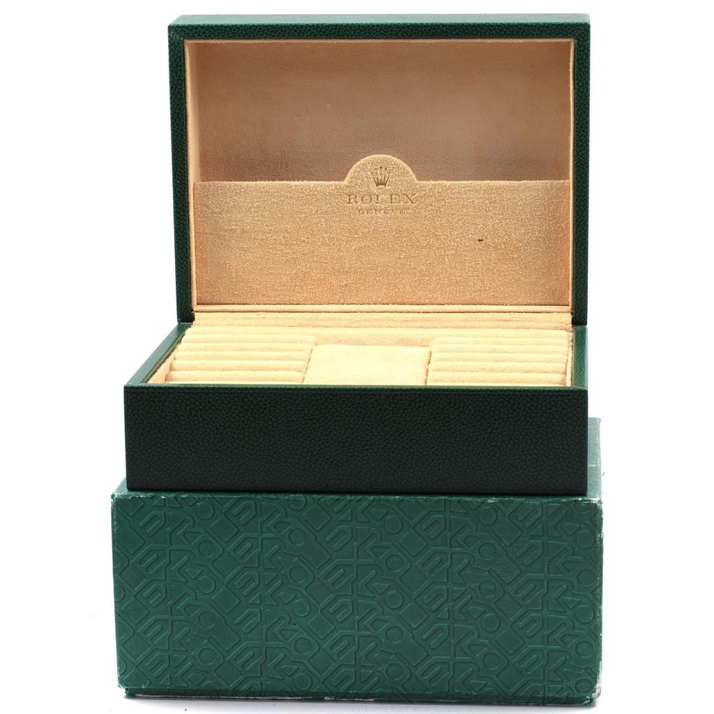 The image shows an open green Rolex President 118238 Men
s Yellow Gold Champagne Dial 118238 Men
s Yellow Gold Champagne Dial model watch box with a beige interior lining.