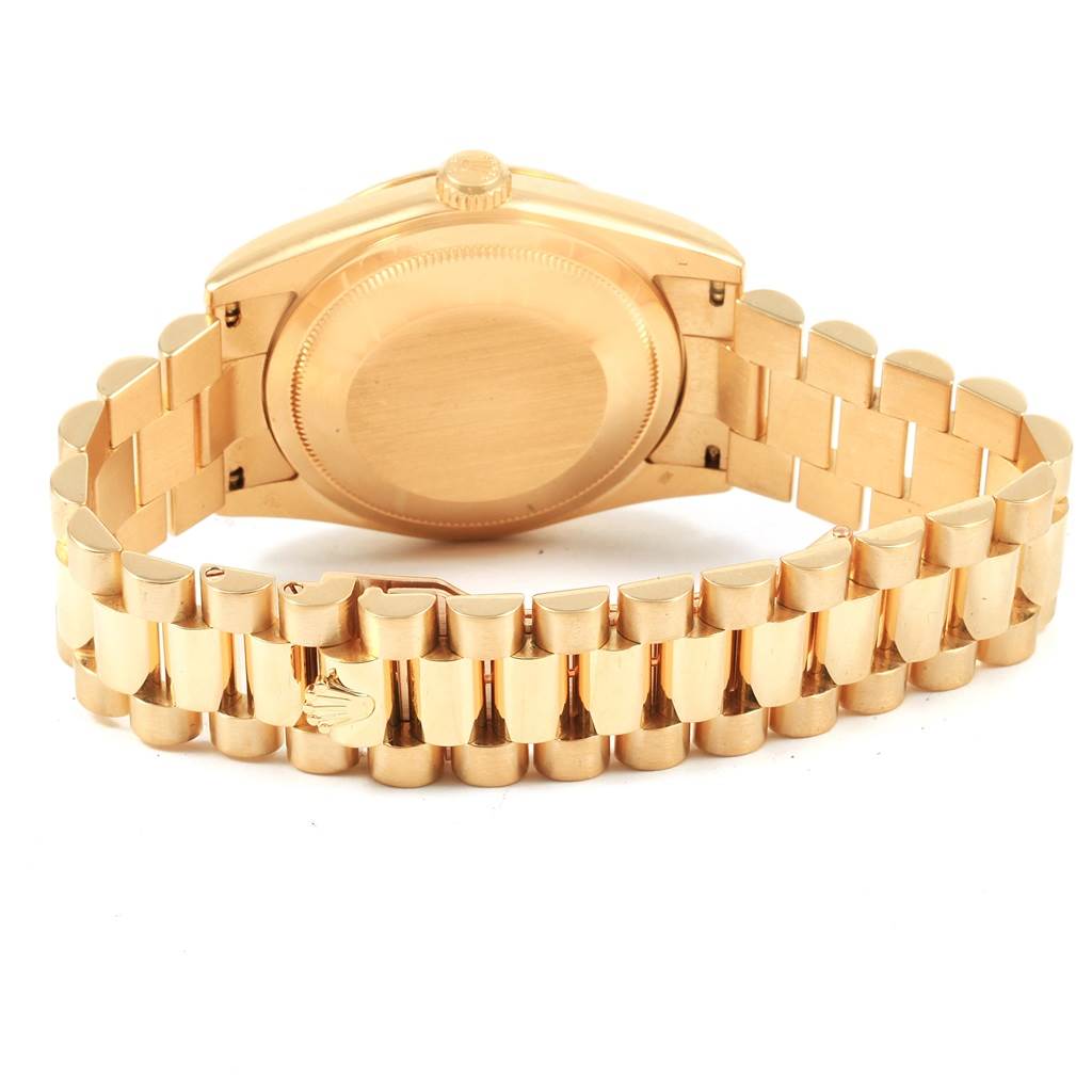 This image shows the back view of the Rolex President 118238 Men
s Yellow Gold Champagne Dial 118238 Men
s Yellow Gold Champagne Dial watch, displaying the case back and the gold President bracelet.