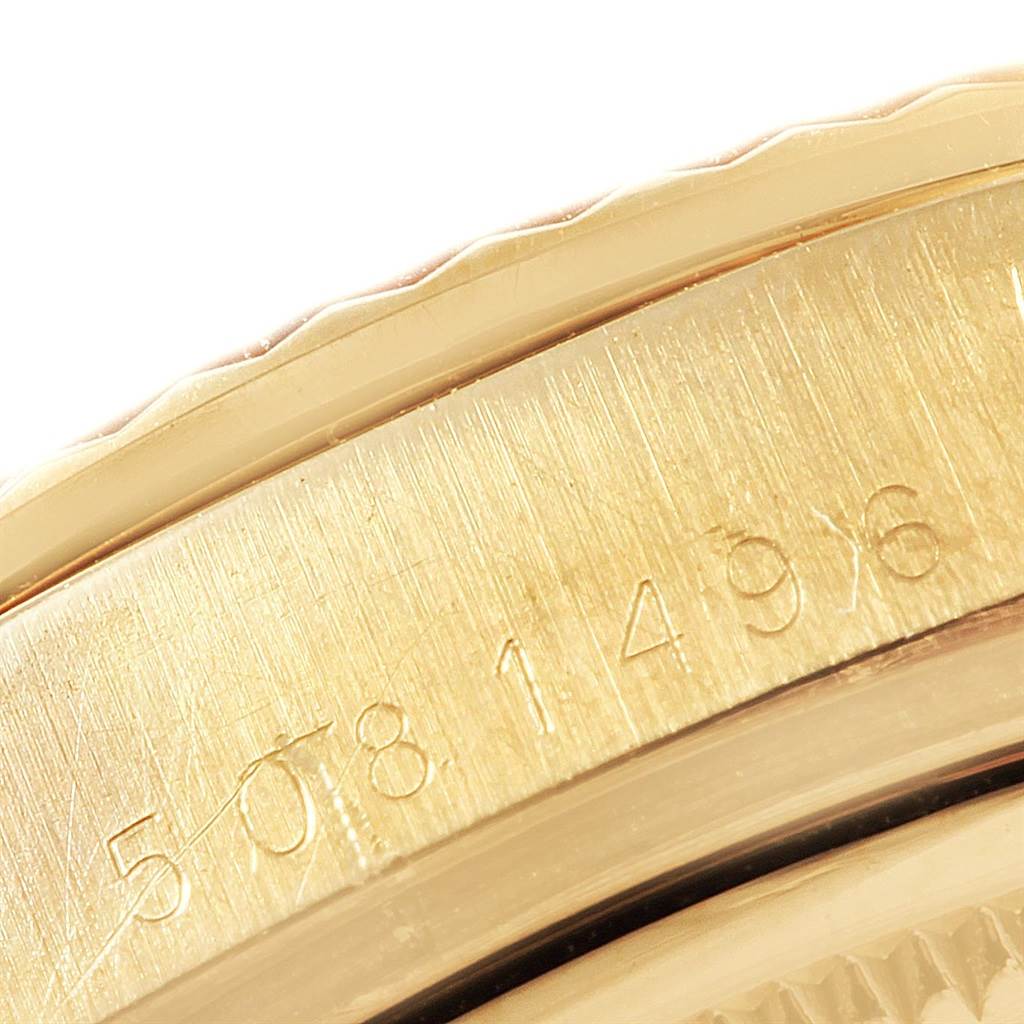 The image shows a close-up of the case side with engraved serial numbers on a Rolex President 1804 Men
s Yellow Gold Champagne Dial 1804 Men
s Yellow Gold Champagne Dial model watch.