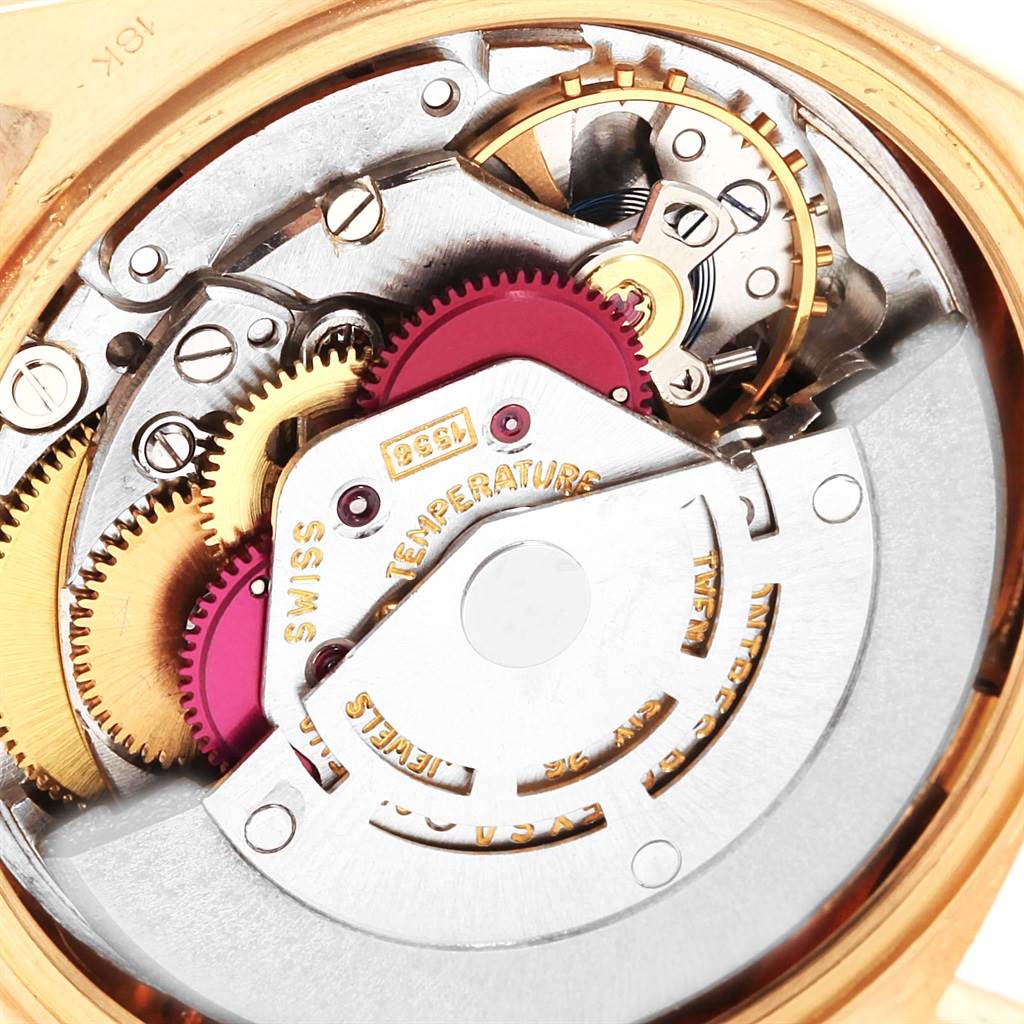 The image shows a close-up of the movement and internal mechanical components of a Rolex President 1804 Men
s Yellow Gold Champagne Dial 1804 Men
s Yellow Gold Champagne Dial model watch.