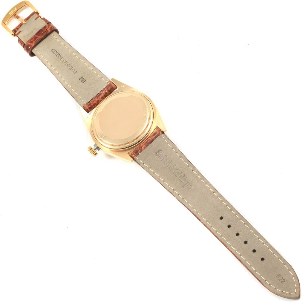 This image shows the back side of a Rolex President 18038 Men
s Yellow Gold Champagne Dial 18038 Men
s Yellow Gold Champagne Dial model watch with its leather straps fully extended.