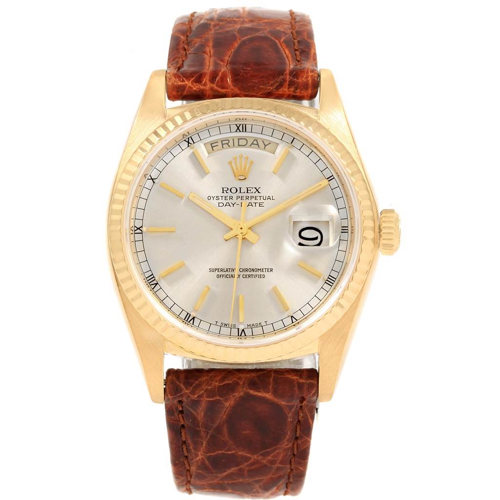 The image shows a Rolex President 18038 Men
s Yellow Gold Champagne Dial 18038 Men
s Yellow Gold Champagne Dial watch from a front angle, displaying its dial, day-date function, and brown leather strap.