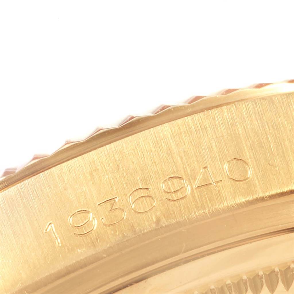 This is a close-up of the case edge of a Rolex President 1803 Men's Yellow Gold Champagne Dial 1803 Men's Yellow Gold Champagne Dial model watch, featuring the serial number engraving.