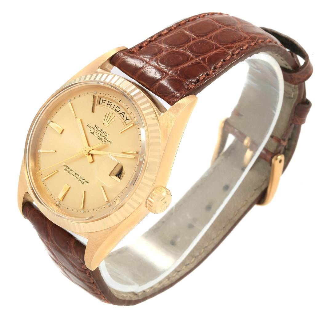 The Rolex President 1803 Men's Yellow Gold Champagne Dial 1803 Men's Yellow Gold Champagne Dial model watch is shown at a slight angle, highlighting its dial, crown, and brown leather strap.