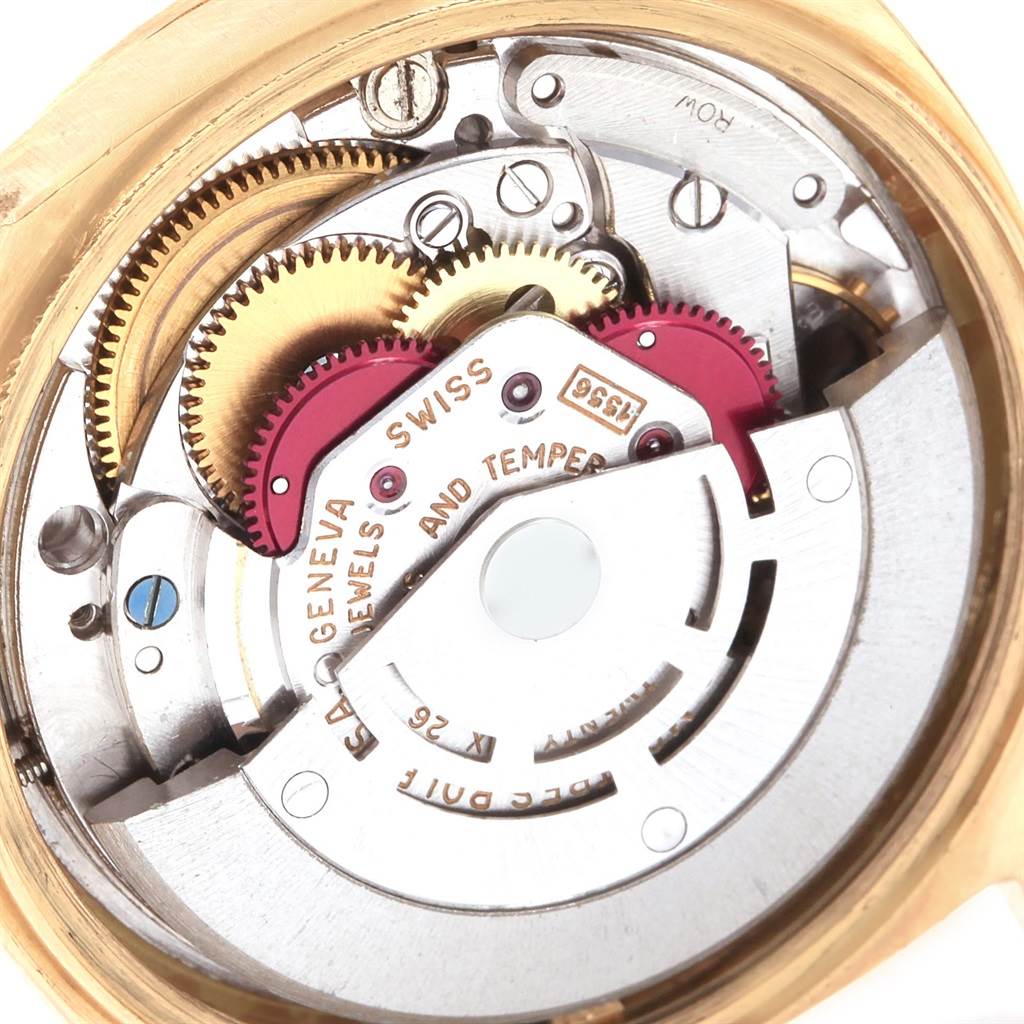 This image shows the intricate internal movement mechanisms of the Rolex President 1807 Men
s Yellow Gold Champagne Dial 1807 Men
s Yellow Gold Champagne Dial watch from a close-up, top-down angle.