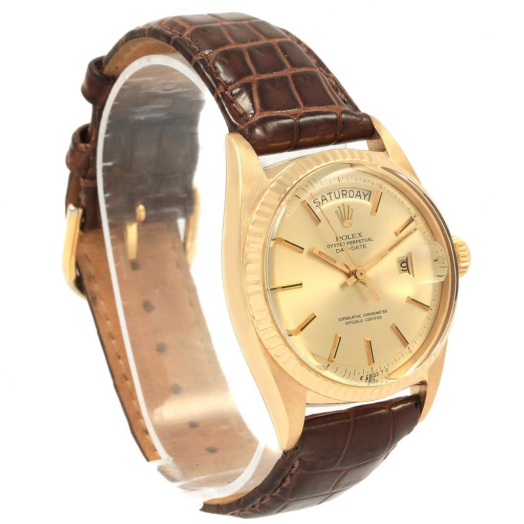 The image shows a Rolex President 1807 Men
s Yellow Gold Champagne Dial 1807 Men
s Yellow Gold Champagne Dial model watch at an angle, highlighting the dial, case, bezel, and leather strap.