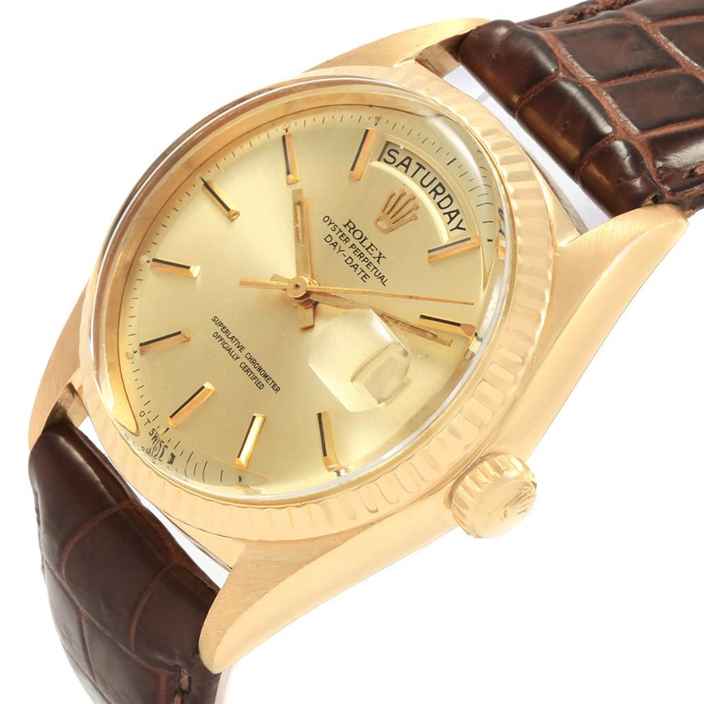 This image shows a Rolex President 1807 Men
s Yellow Gold Champagne Dial 1807 Men
s Yellow Gold Champagne Dial model watch at an angled view, highlighting its gold dial, day-date feature, and leather strap.