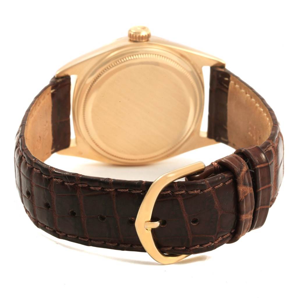 The image shows the back case and leather strap of a Rolex President 1807 Men
s Yellow Gold Champagne Dial 1807 Men
s Yellow Gold Champagne Dial model watch.