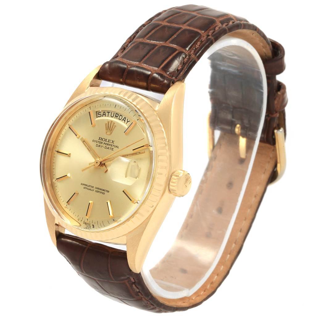 This image shows a Rolex President 1807 Men
s Yellow Gold Champagne Dial 1807 Men
s Yellow Gold Champagne Dial watch at a three-quarter angle, highlighting the dial, case, and leather strap.