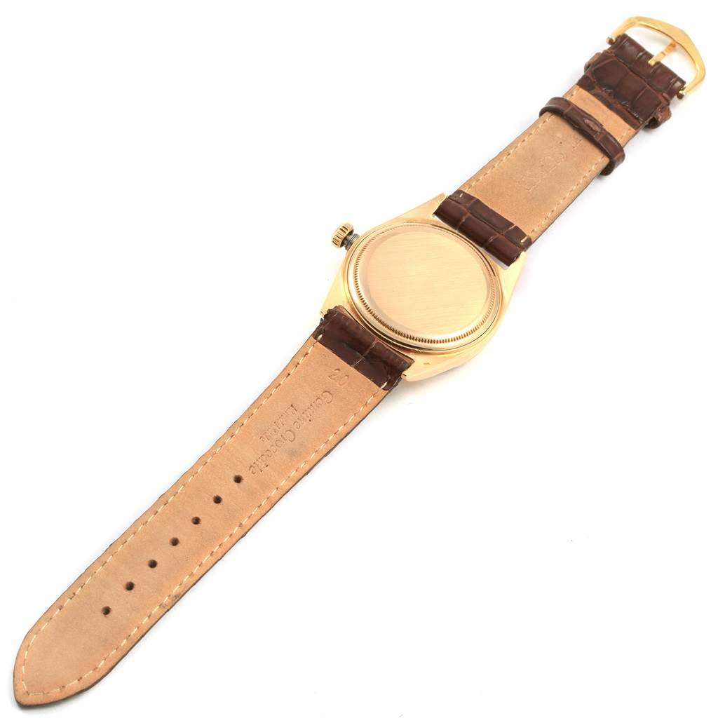 The image shows the back view of a Rolex President 1807 Men
s Yellow Gold Champagne Dial 1807 Men
s Yellow Gold Champagne Dial model watch, displaying the case and leather strap.