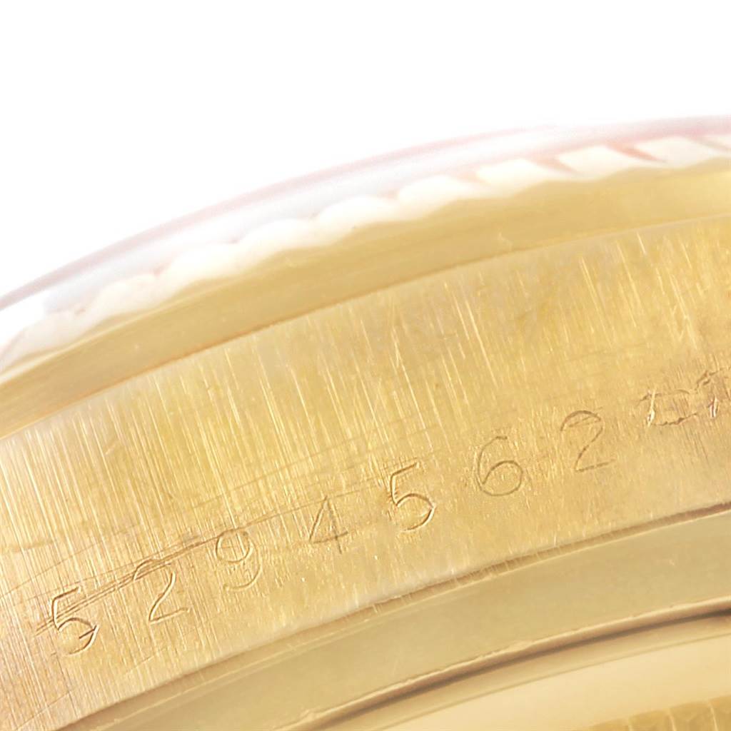 This close-up image shows the serial number engraving on the gold caseback of a Rolex President 18038 Men
s Yellow Gold Champagne Dial 18038 Men
s Yellow Gold Champagne Dial model watch.