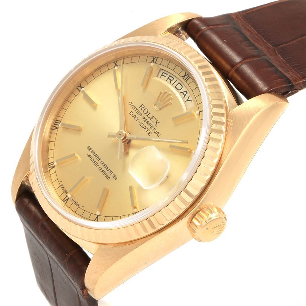 The image shows a Rolex President 18038 Men
s Yellow Gold Champagne Dial 18038 Men
s Yellow Gold Champagne Dial model watch angled to display the dial, crown, and part of the brown leather strap.