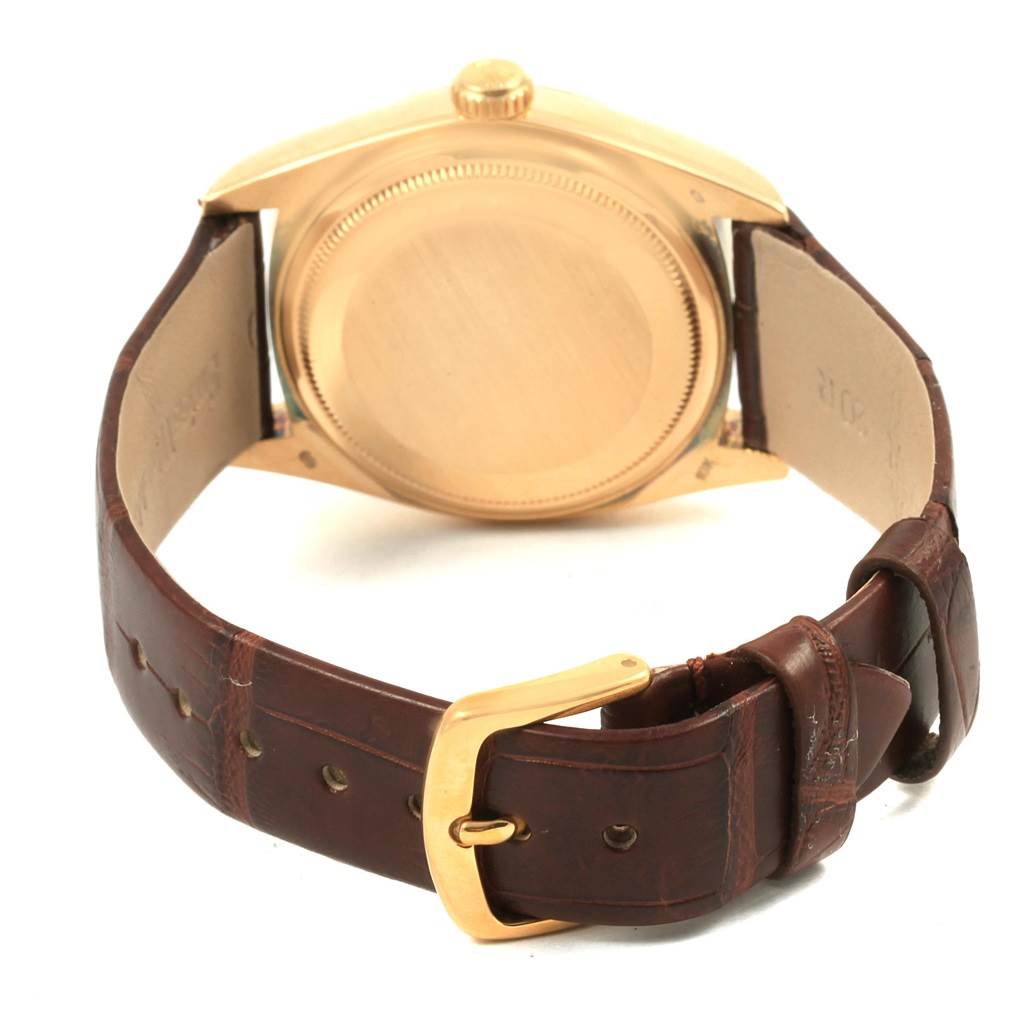 The image shows the back and strap of a Rolex President 18038 Men
s Yellow Gold Champagne Dial 18038 Men
s Yellow Gold Champagne Dial model watch, in a slightly angled rear view.
