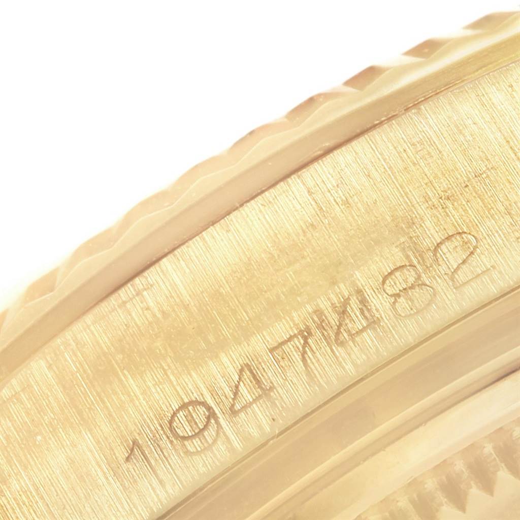 This image shows a close-up of the serial number engraving on the edge of the case of a Rolex President 1803 Men
s Yellow Gold Champagne Dial 1803 Men
s Yellow Gold Champagne Dial model watch.