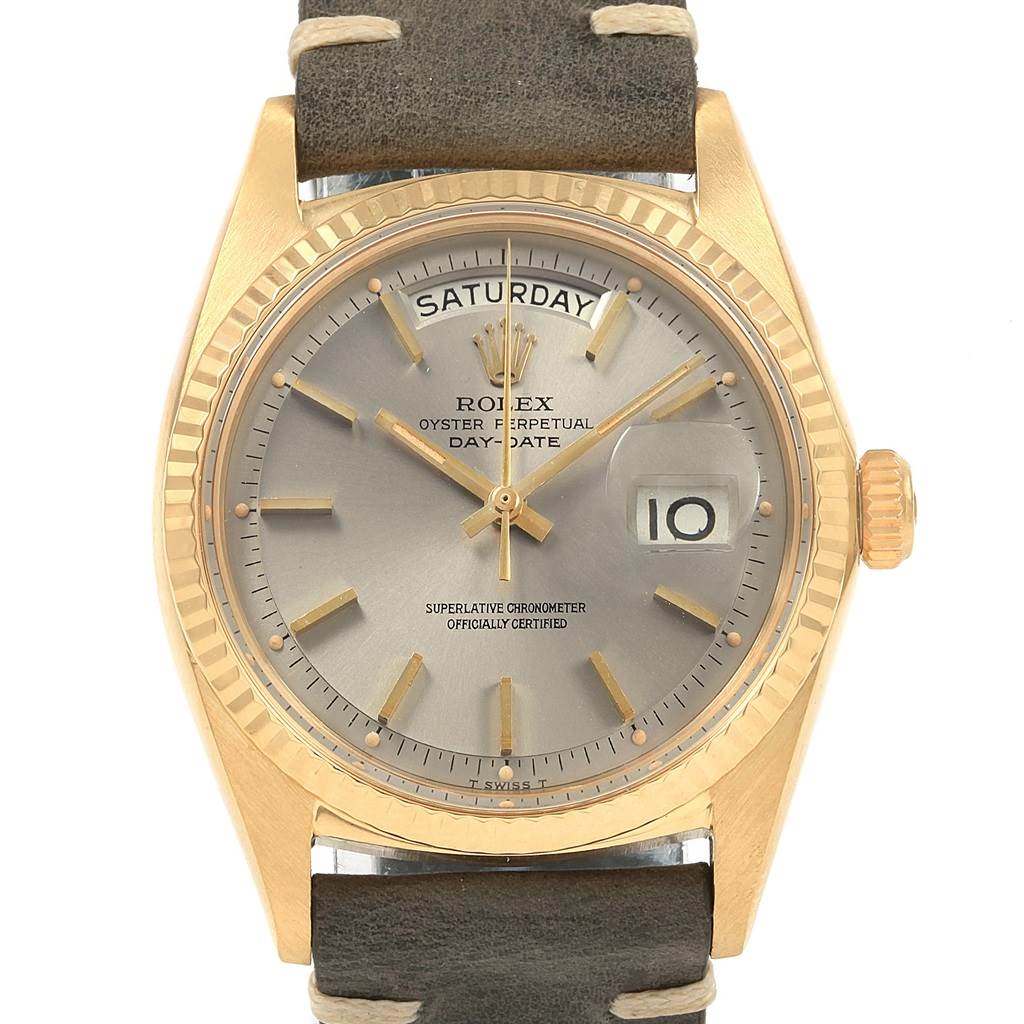 The image shows a frontal view of a Rolex President 1803 Men
s Yellow Gold Champagne Dial 1803 Men
s Yellow Gold Champagne Dial model watch, highlighting its dial, day-date display, and leather strap.