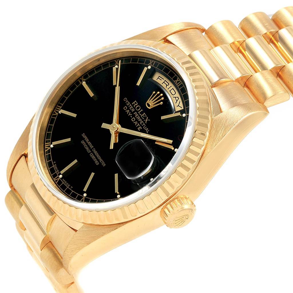 This image shows a partial angled view of a Rolex President 18238 Men
s Yellow Gold Black Dial 18238 Men
s Yellow Gold Black Dial model watch, highlighting the black dial and gold bracelet.