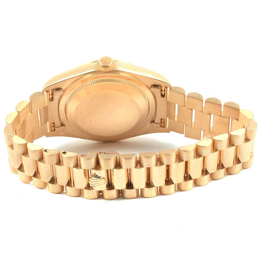 The image shows the back case and bracelet of the Rolex President 18238 Men
s Yellow Gold Black Dial 18238 Men
s Yellow Gold Black Dial watch in a gold finish.