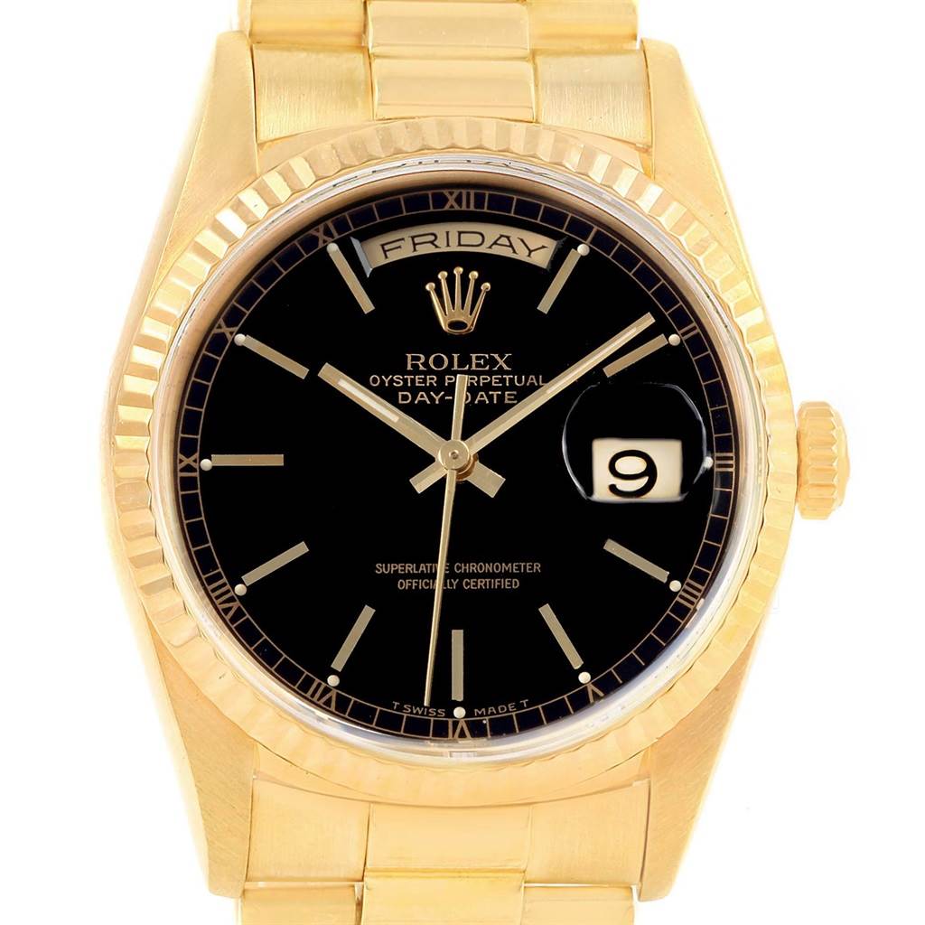 The image shows a frontal view of a Rolex President 18238 Men
s Yellow Gold Black Dial 18238 Men
s Yellow Gold Black Dial model watch, highlighting its black dial, date display, and gold strap.