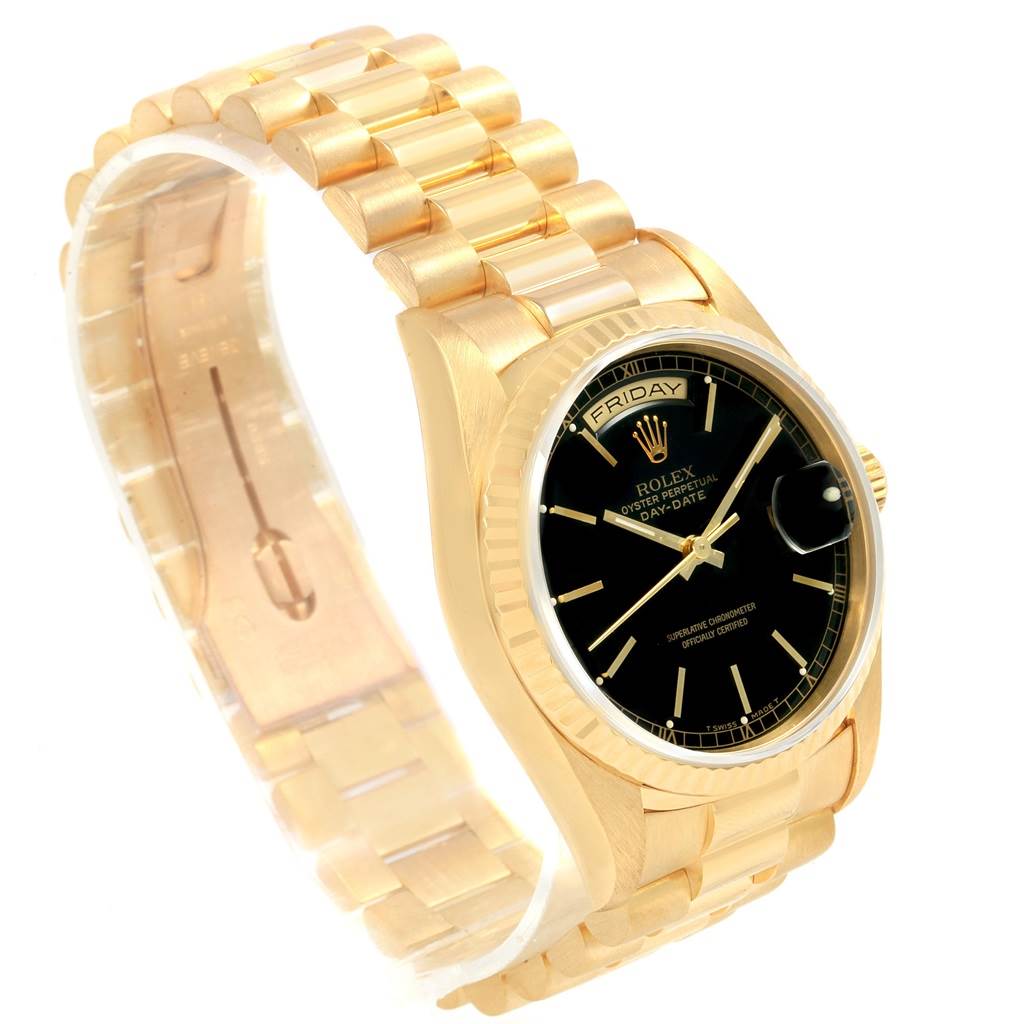 This image shows a close-up angle of the Rolex President 18238 Men
s Yellow Gold Black Dial 18238 Men
s Yellow Gold Black Dial model, highlighting the gold bracelet and black dial.