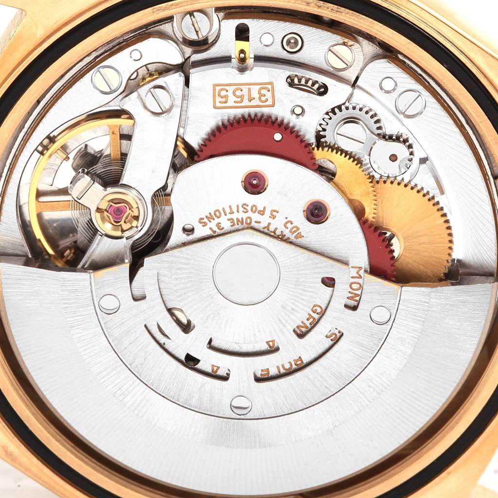 This image shows the close-up movement and internal components of the President model Rolex watch.