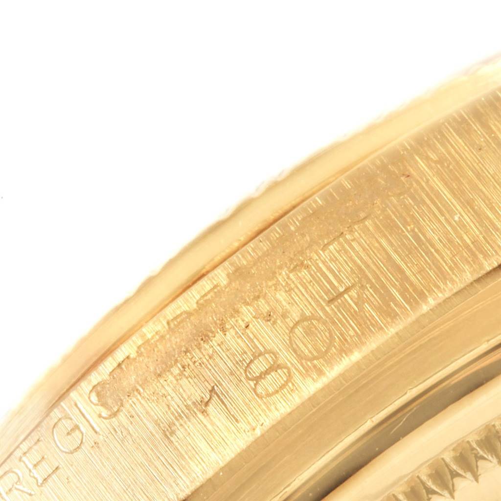 This close-up image shows the edge of the gold bezel on a Rolex President 1807 Men
s Yellow Gold White Dial 1807 Men
s Yellow Gold White Dial watch model.