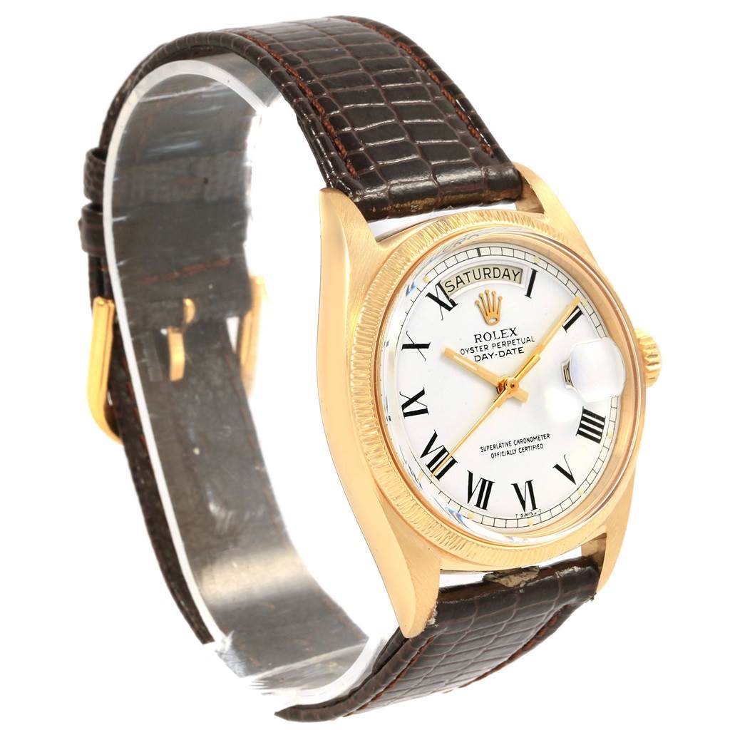 This image shows a Rolex President 1807 Men
s Yellow Gold White Dial 1807 Men
s Yellow Gold White Dial model watch from an angled front view, highlighting the dial, bezel, and leather strap.