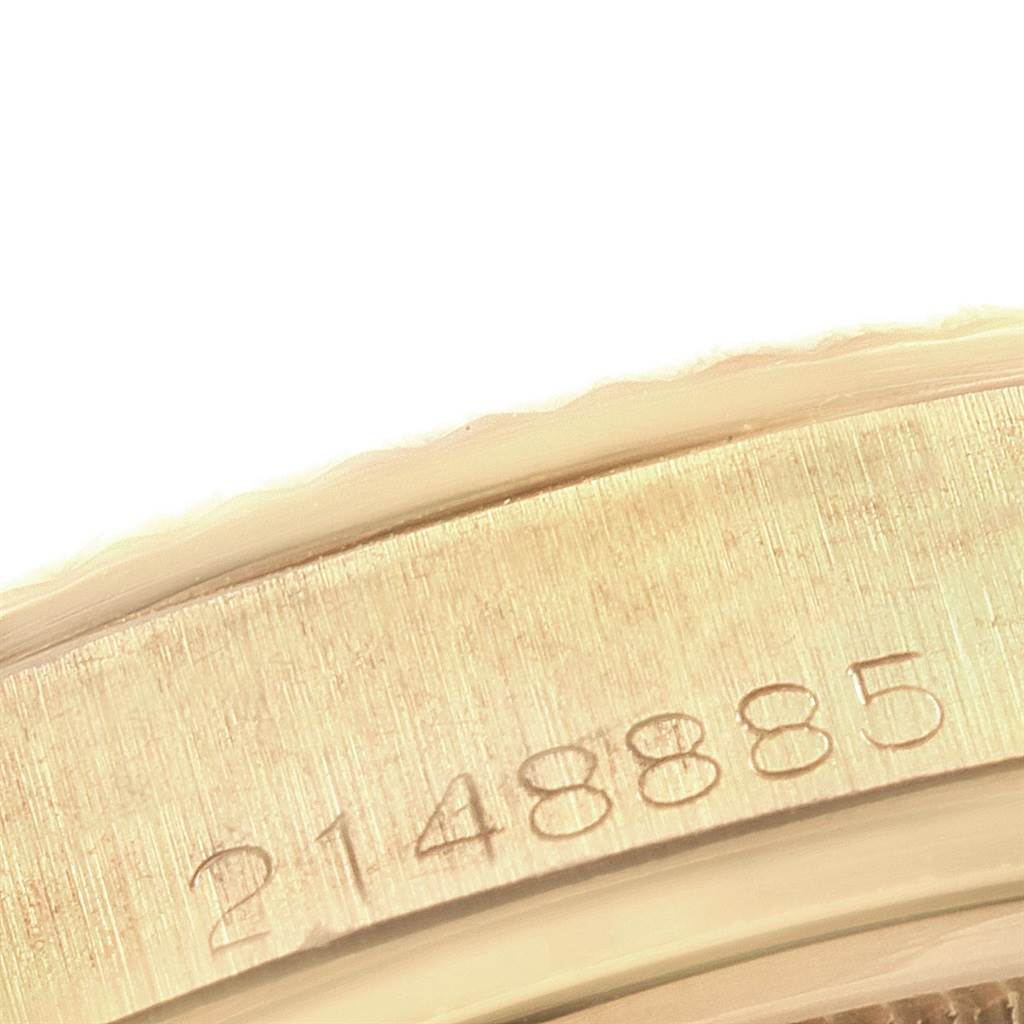 This close-up image shows the serial number engraving on the inner bezel of a Rolex President 1803 Men
s Yellow Gold Silver Dial 1803 Men
s Yellow Gold Silver Dial model watch.