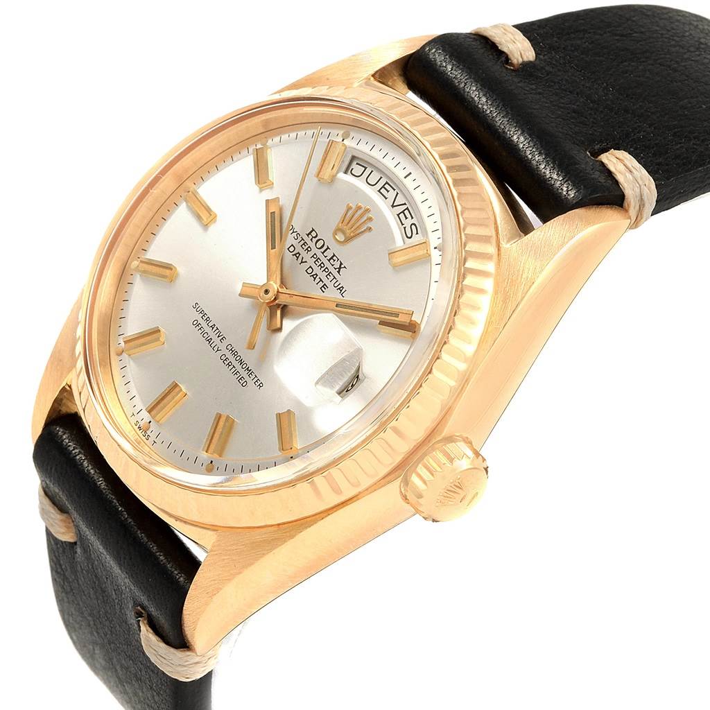 The image shows a close-up angled view of the Rolex President 1803 Men
s Yellow Gold Silver Dial 1803 Men
s Yellow Gold Silver Dial watch, highlighting its bezel, dial, and crown with a leather strap.