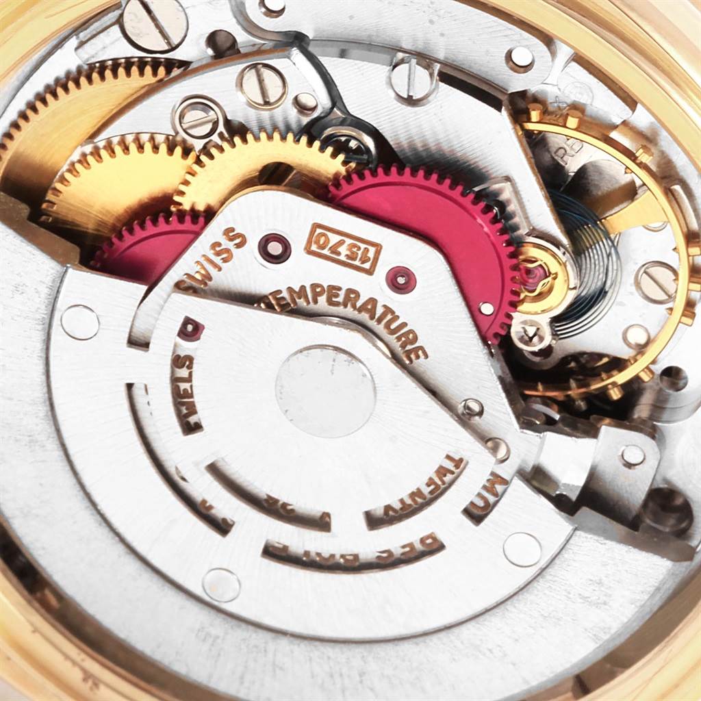 The image shows a close-up of the movement mechanism inside a Rolex President 1803 Men
s Yellow Gold Silver Dial 1803 Men
s Yellow Gold Silver Dial model watch.