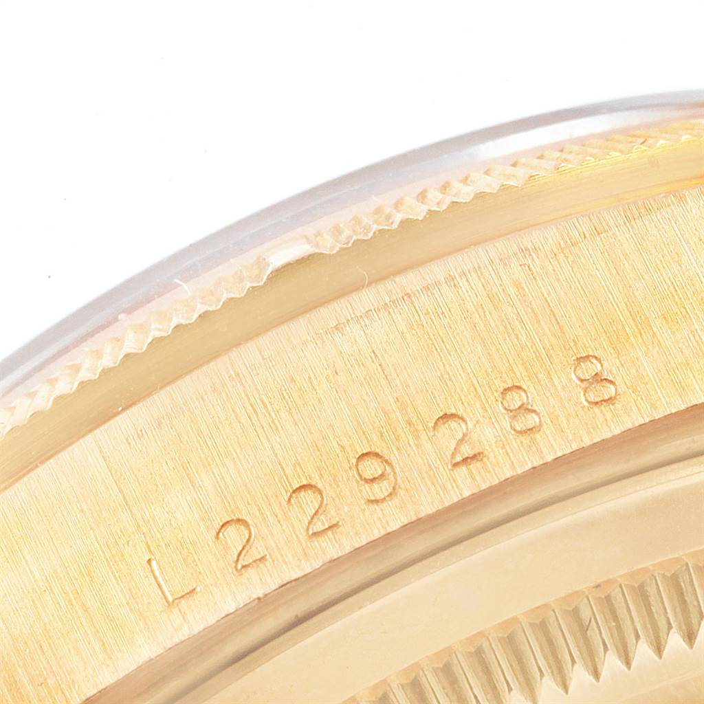 This close-up image shows the serial number engraved on the case back edge of a Rolex President 18248 Men
s Yellow Gold Champagne Dial 18248 Men
s Yellow Gold Champagne Dial model.