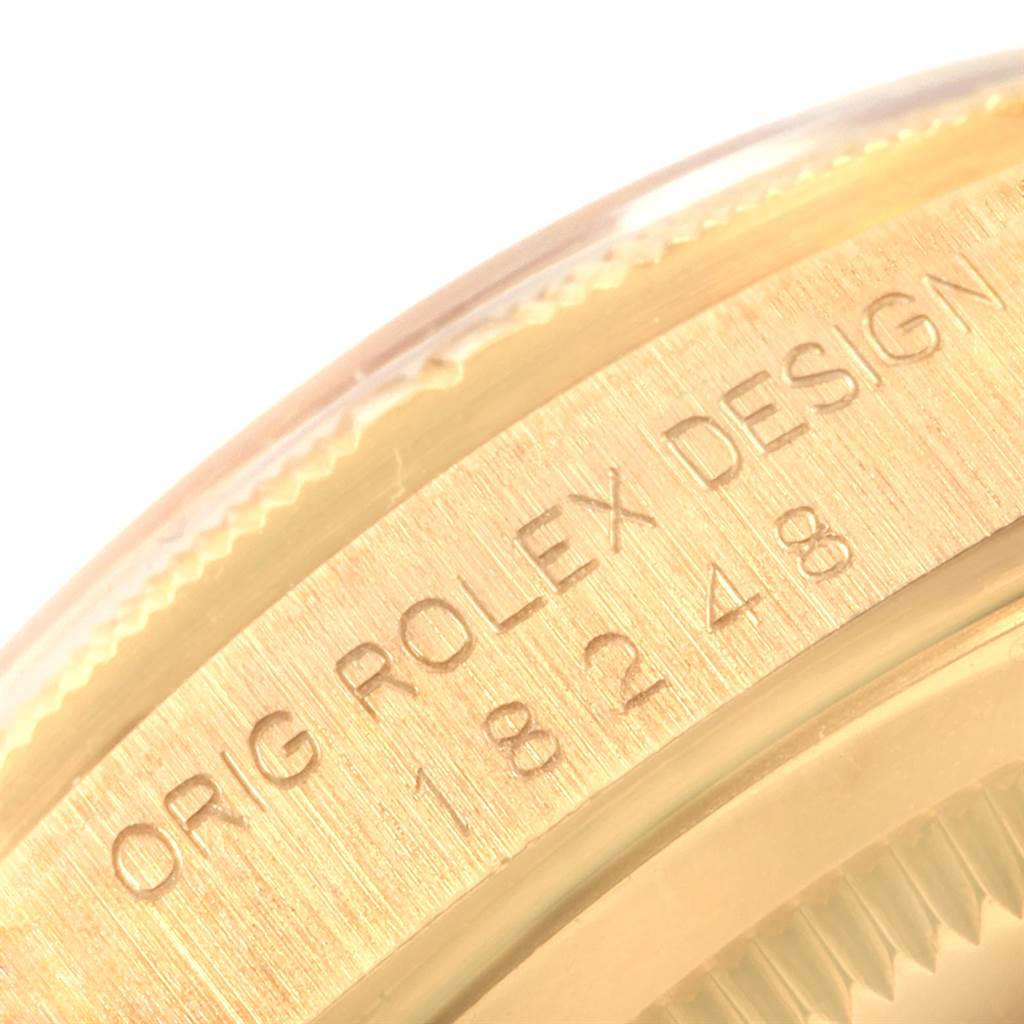 The close-up image shows the side engraving of a Rolex President 18248 Men
s Yellow Gold Champagne Dial 18248 Men
s Yellow Gold Champagne Dial model watch, displaying part of the model number.
