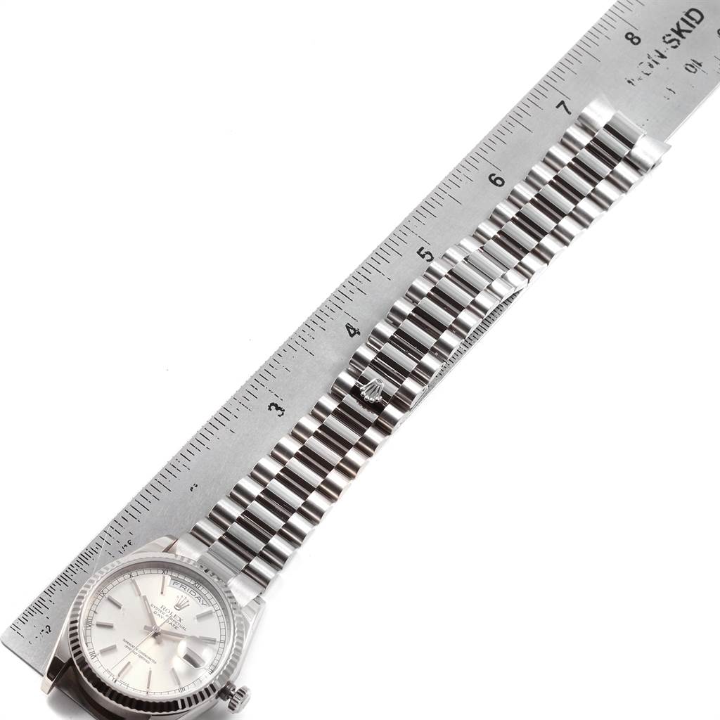 The image shows a Rolex President 118239 Men's White Gold Silver Dial 118239 Men's White Gold Silver Dial model watch laid flat next to a ruler, highlighting the face and full length of the bracelet.