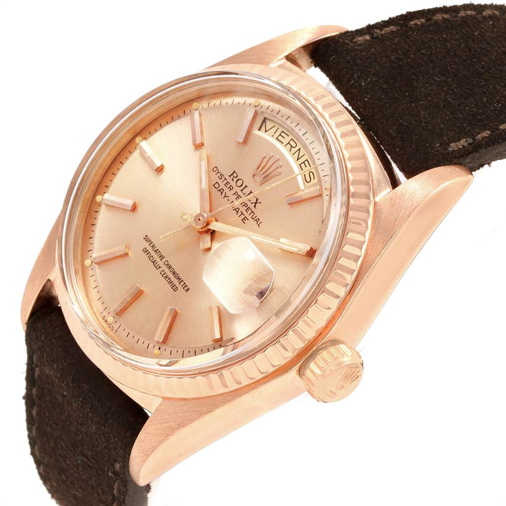 This image shows a close-up angle of a Rolex President 1803 Men's Rose Gold Pink Dial 1803 Men's Rose Gold Pink Dial model watch, highlighting the dial, crown, and partially the strap.
