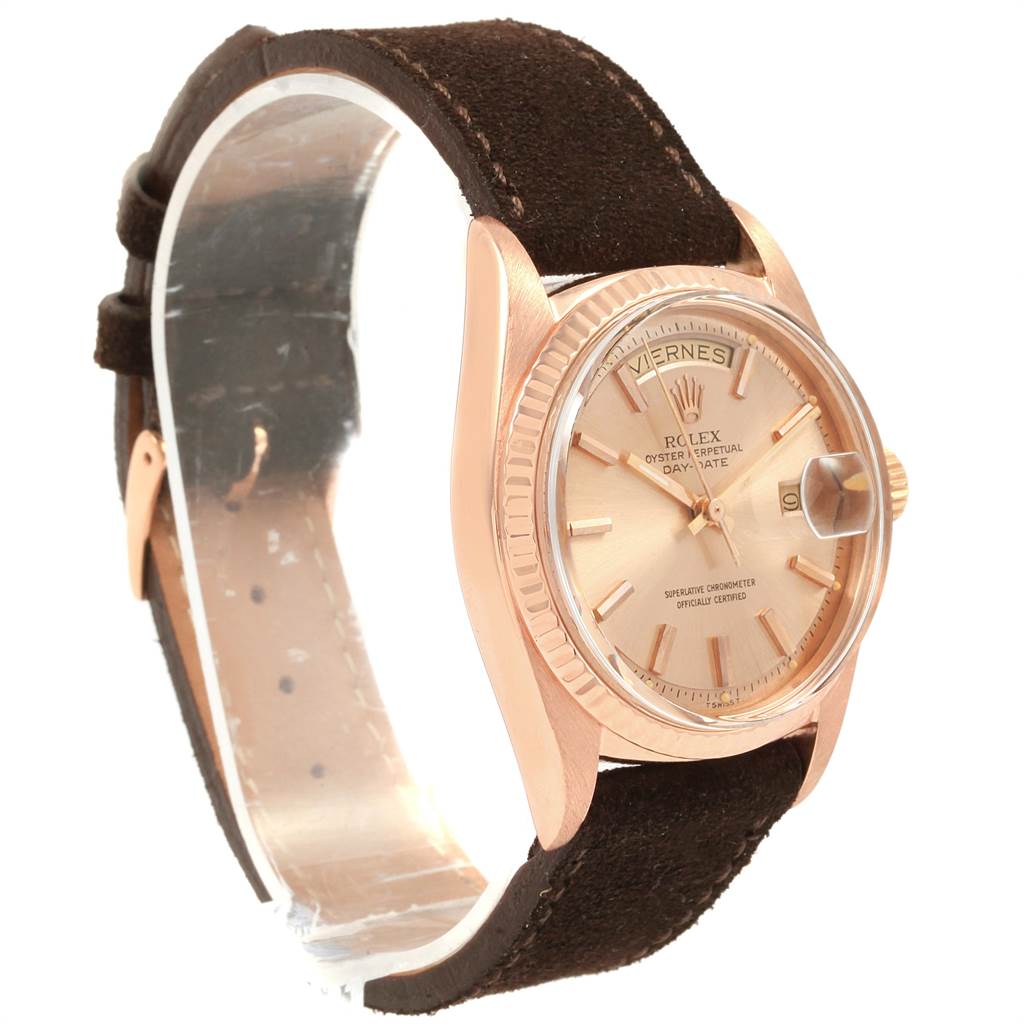 The Rolex President 1803 Men's Rose Gold Pink Dial 1803 Men's Rose Gold Pink Dial watch is shown from a 3/4 angle, displaying its face, bezel, crown, and part of its strap.